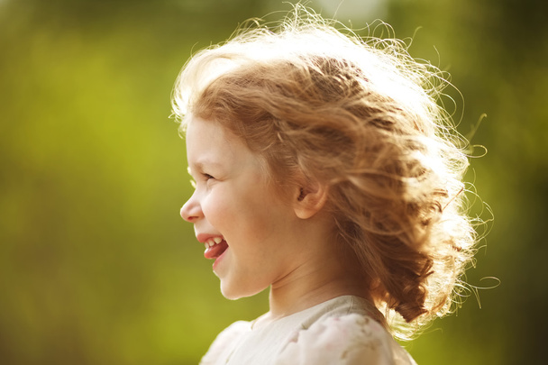Happy little girl with disheveled hair - Zdjęcie, obraz