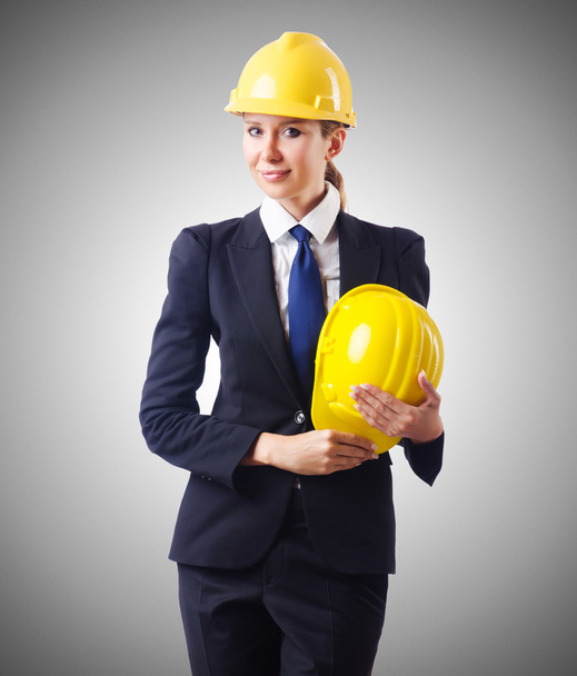 Young businesswoman with hard hat - Foto, Bild