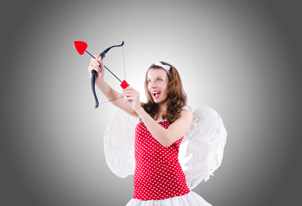 žena s lukem v valentine koncepce - Fotografie, Obrázek