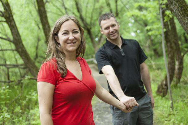 couple standing on forest trail  - Fotoğraf, Görsel
