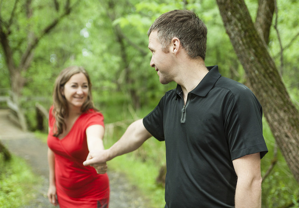 couple standing on forest trail  - 写真・画像