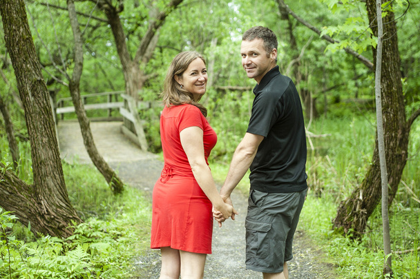 couple standing on forest trail  - Фото, зображення
