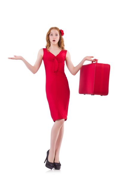 meisje in de rode jurk bedrijf trunk - Foto, afbeelding