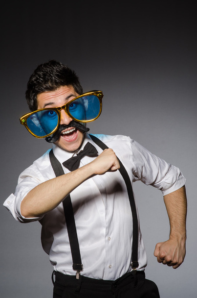 Young man with false moustache - Fotó, kép