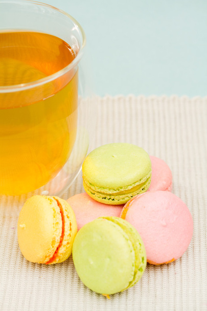 Delicate French cookies and glass cup of tea - Photo, Image
