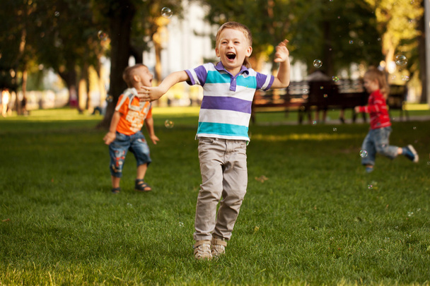 Group of kids playing in urban neighborhood - Φωτογραφία, εικόνα