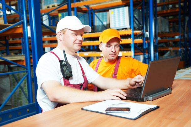 manual workers in warehouse - Фото, зображення
