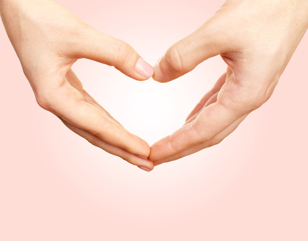 Hands in shape of heart on light background - Photo, Image