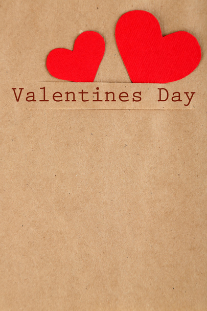 Paper hearts on brown background, close up - Fotó, kép