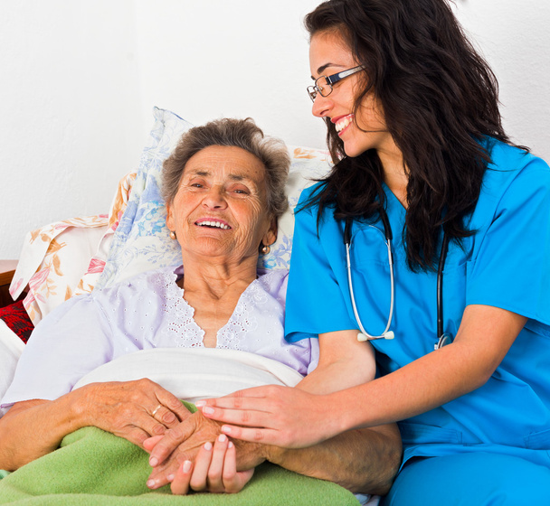 Nurse with Elderly woman - Foto, afbeelding