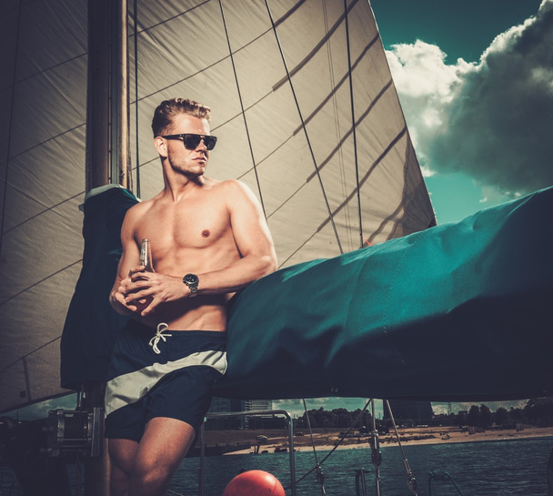 Handsome man on a regatta  - Foto, imagen