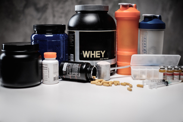 Bodybuilding nutrition supplements and chemistry  - Photo, Image