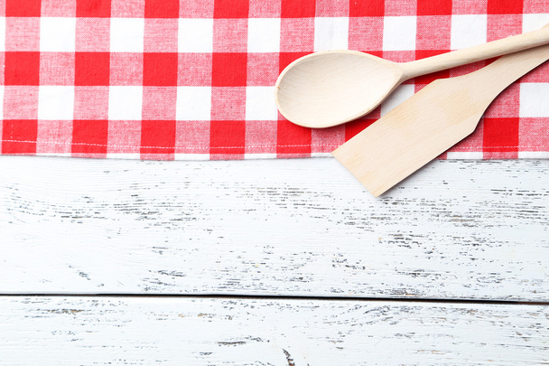 wooden spoon and napkin on white background - Φωτογραφία, εικόνα