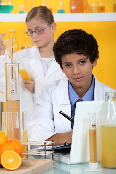 Little boy in chemistry class - Фото, изображение