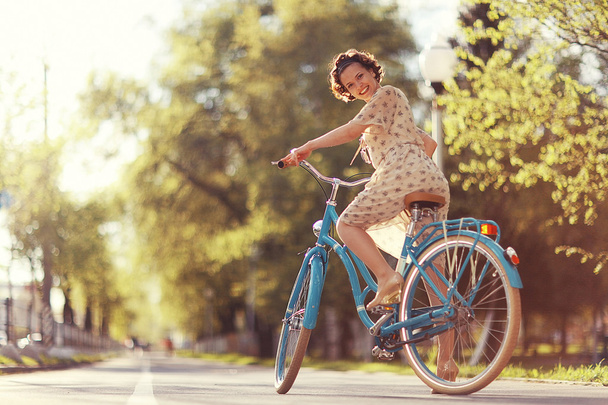 young girl  riding retro  bicycle - Fotoğraf, Görsel