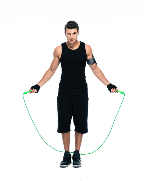 Handsome man working out with skipping rope - Foto, immagini