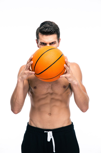 Portrait of basketball player holding ball - Foto, Imagem