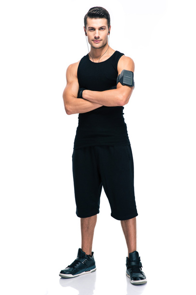 Sports man standing with arms folded - Photo, Image