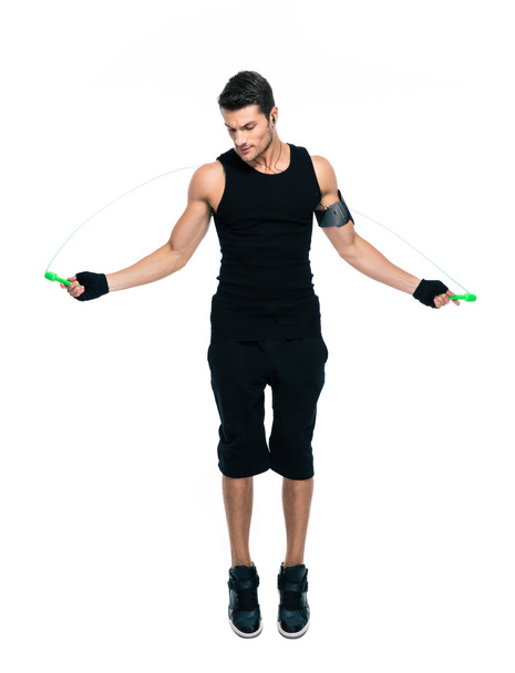 Fitness man jumping with skipping rope - Foto, immagini