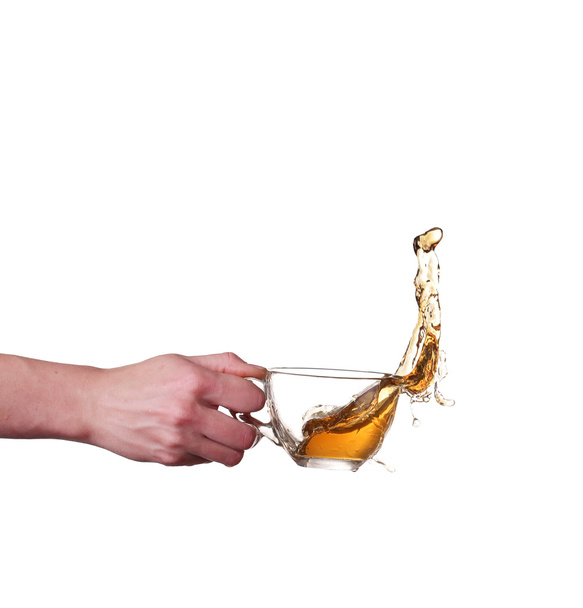 Glass cup of tea with splash - Фото, изображение