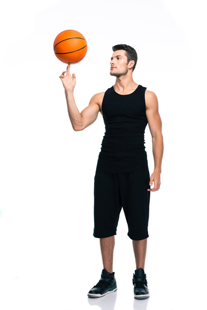 Basketball player spinning ball on his finger - Zdjęcie, obraz