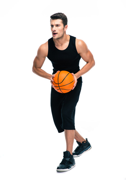Full length portrait of a man playing in basketball - Foto, imagen
