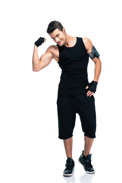 Happy fitness man showing his biceps  - Zdjęcie, obraz