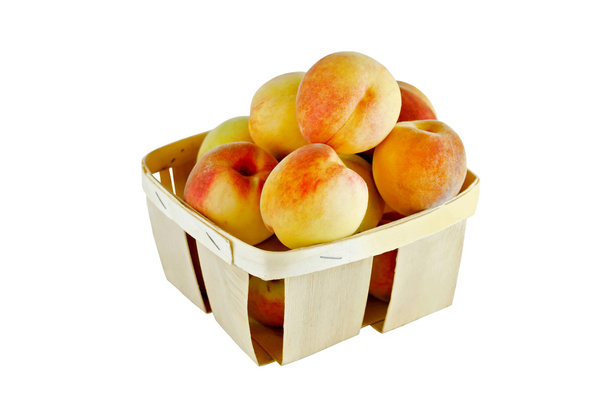 персики в корзине - Фото, изображение