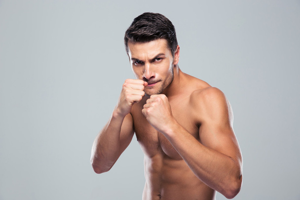 Portrait of a muscular male fighter - Foto, Imagen