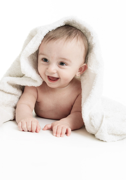 Sweet small baby covered with a towel - Foto, Bild