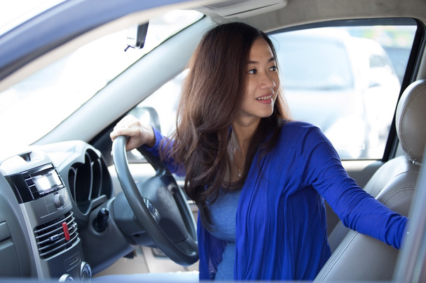 Young Asian woman on ride, a car. - Foto, Bild