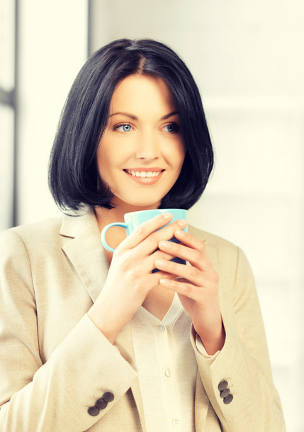 lovely businesswoman with mug - Photo, Image