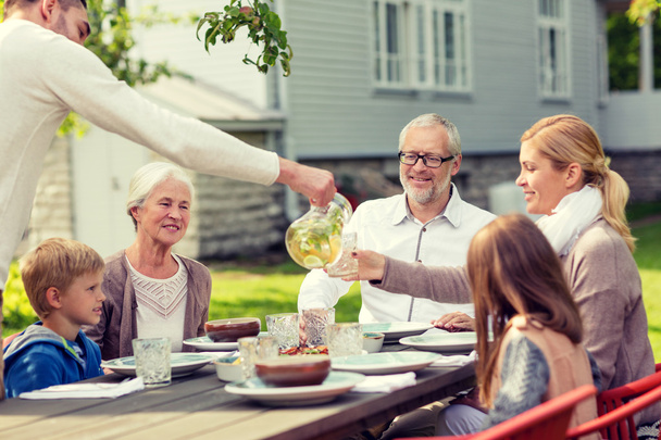 happy family having holiday dinner outdoors - Zdjęcie, obraz