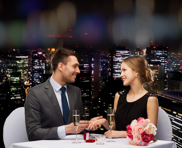 man proposing to his girlfriend at restaurant - Fotó, kép