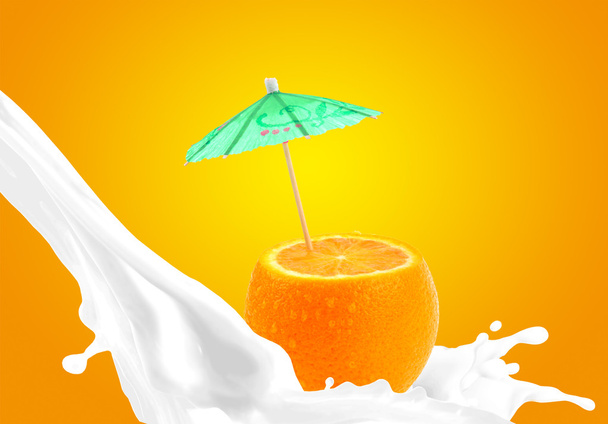 Splashing milk with orange - Photo, Image