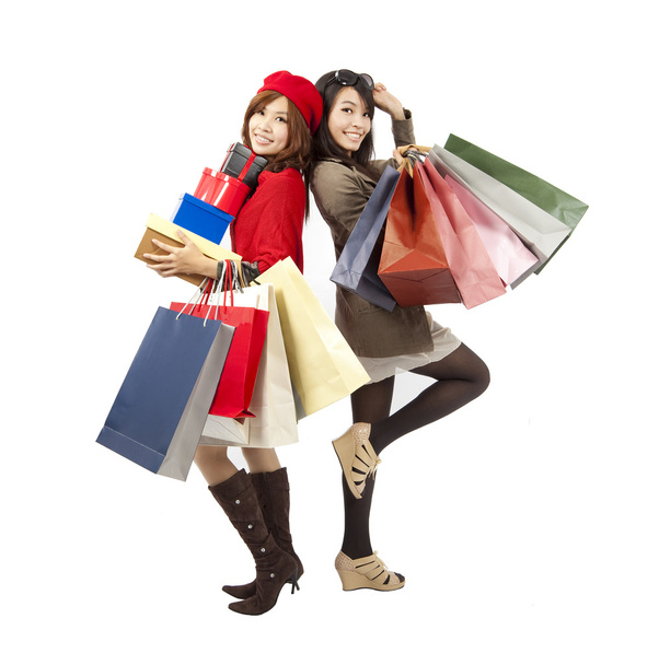 Щасливі азіатські дівчата моди тримають сумку і подарункову коробку
 - Фото, зображення