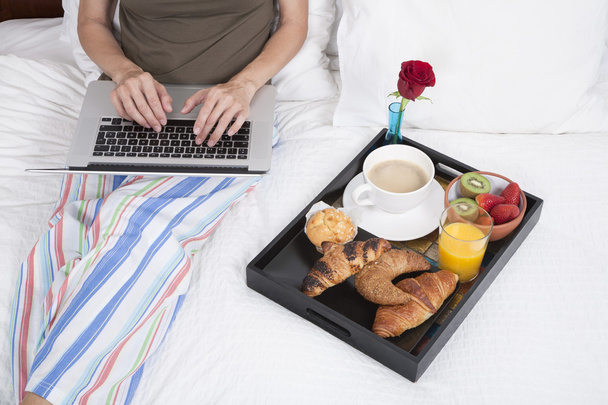typing and breakfast on bed - Photo, Image