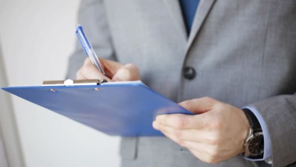close up of man with business scheme and clipboard - Séquence, vidéo