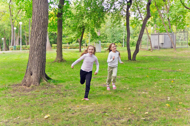 Cute two running girls - Valokuva, kuva