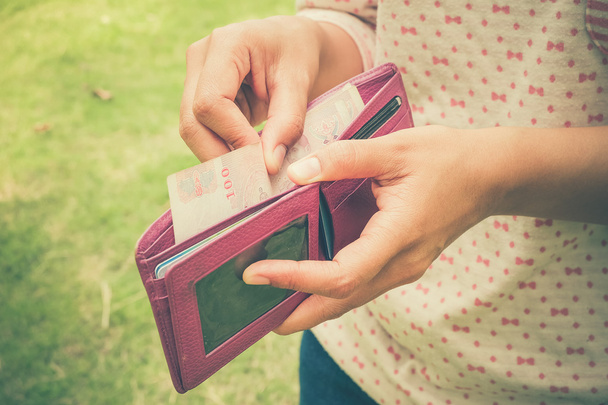 take money from the wallet with filter effect retro vintage styl - 写真・画像