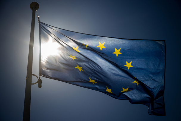 European Union flag on blue sky background - Fotografie, Obrázek