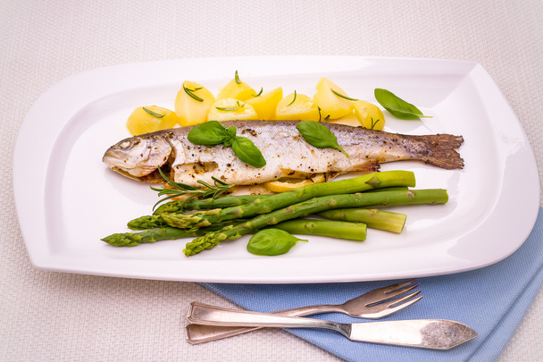 Grilled trout, rosemary potatoes, green asparagus - Photo, Image