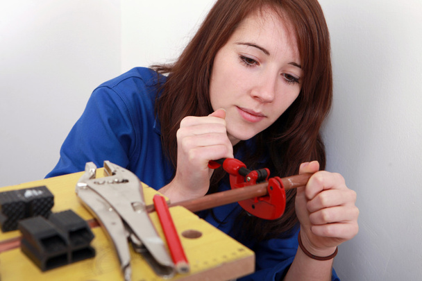 Red-haired girl working as plumber - Fotoğraf, Görsel