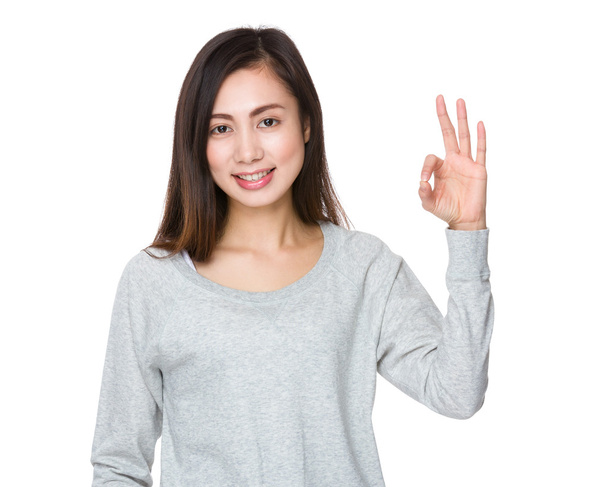 Asian young woman in grey sweater - Foto, Imagem