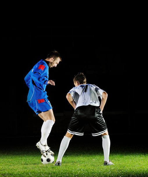 Football players in action for the ball - Valokuva, kuva