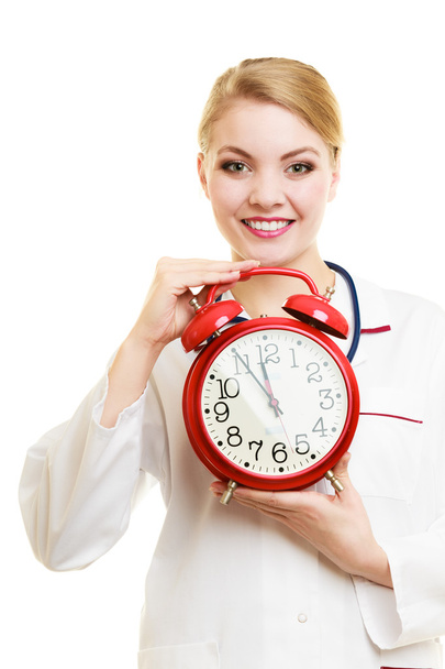 Woman doctor holding clock - Foto, Imagem