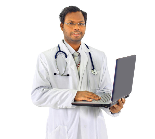 Beautiful african-american doctor, holding the laptop. Isolated on a white - Φωτογραφία, εικόνα