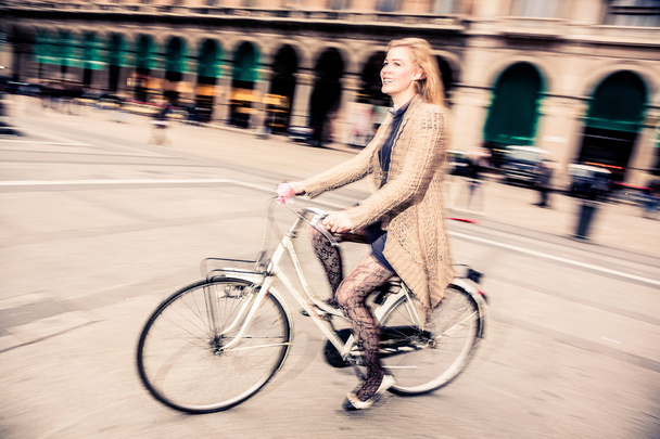 Woman riding her bicycle - 写真・画像