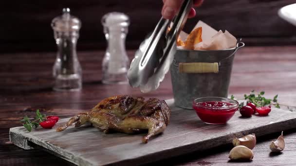 Roasted quail with a garnish. - Footage, Video