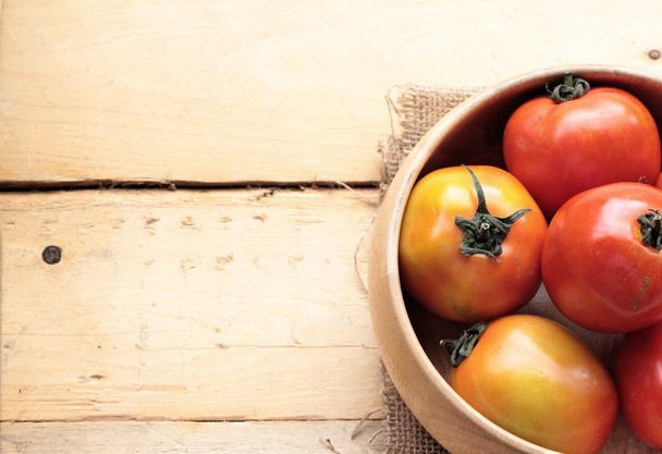 Fresh tomato on wood background - Foto, imagen